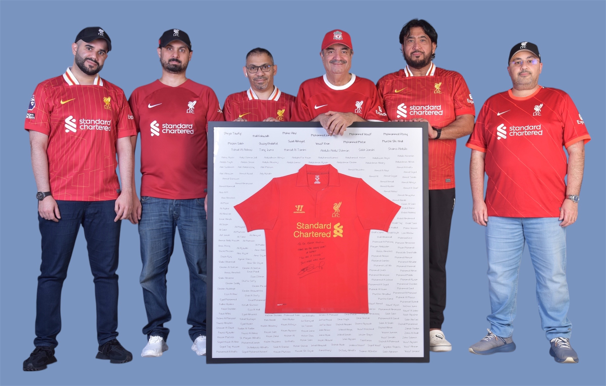 Current Board members with Honorary Chairman Dr Dheya Tawfiqi and the framed shirt