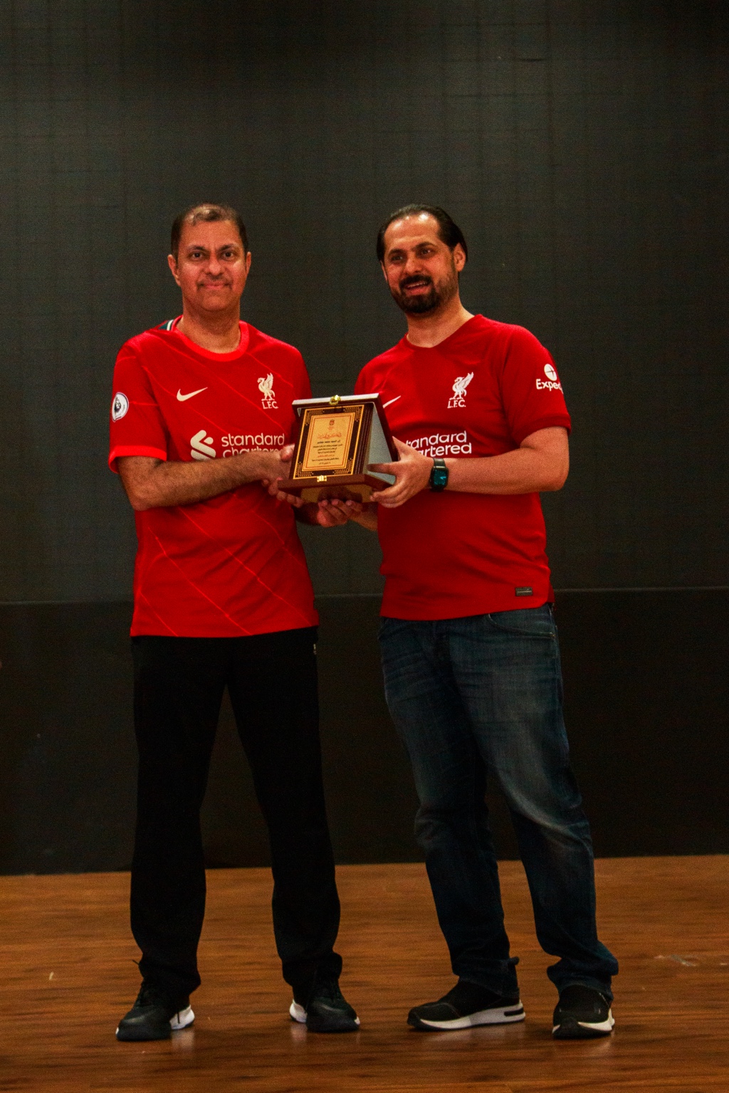 Mohammed Jamsheer receiving a commemorative shield
